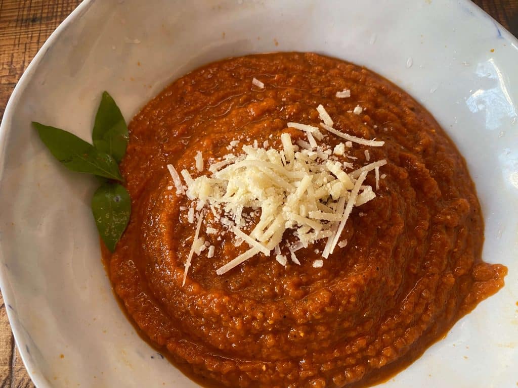 Red sauce topped with Parmesan cheese.